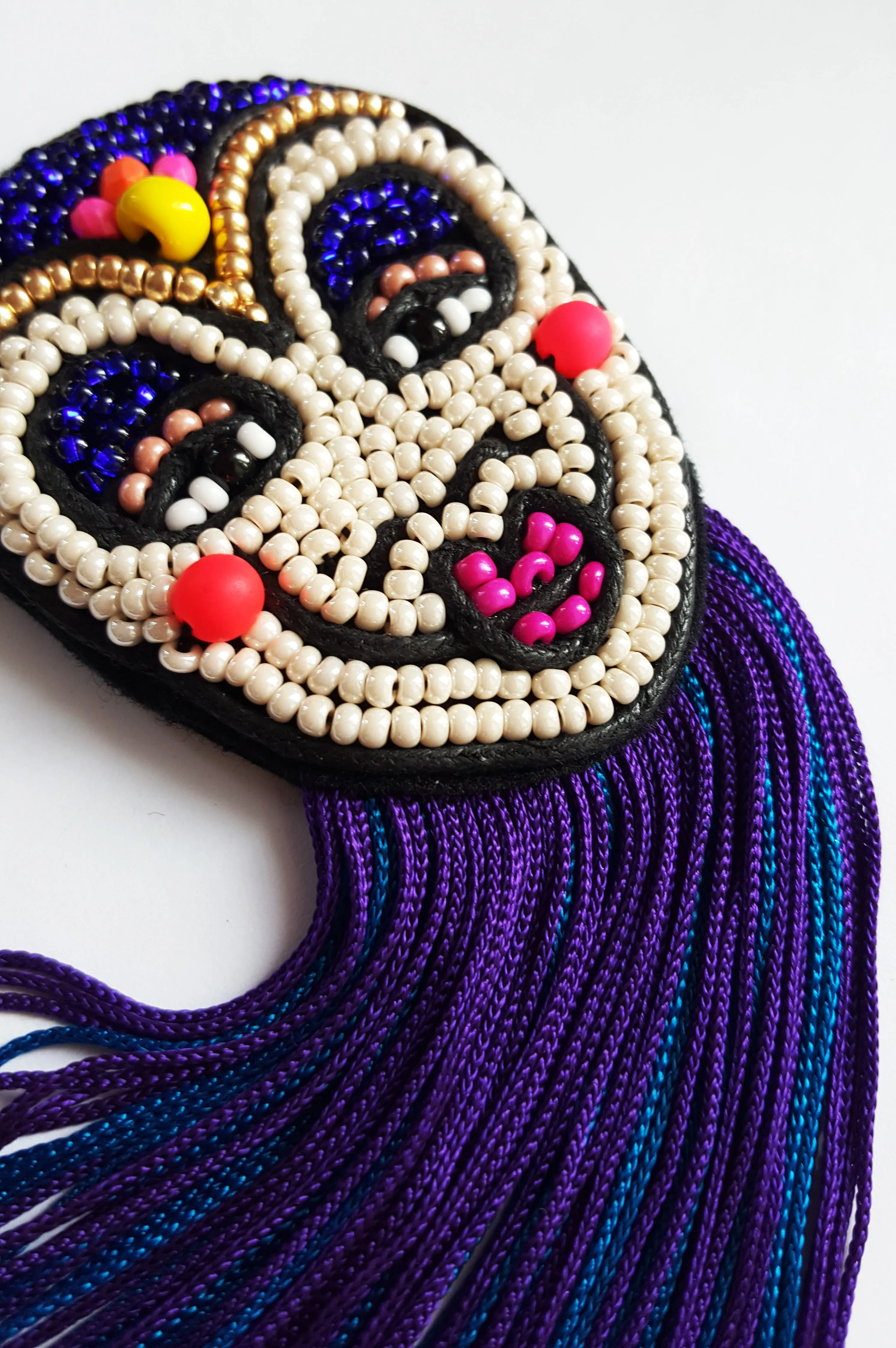 Colorful Rigoletto Inspired Mask Brooch with Long Blue and Purple Fringe