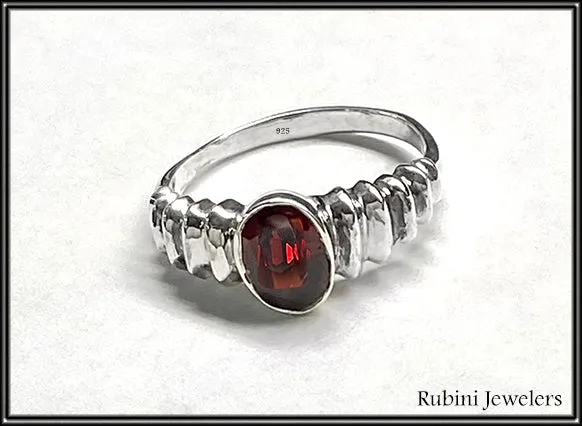 Ribbed shoulder oval garnet ring