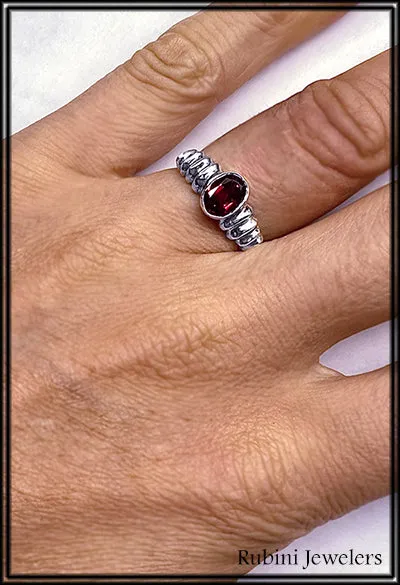 Ribbed shoulder oval garnet ring